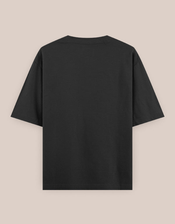 Black t-shirt on a beige background