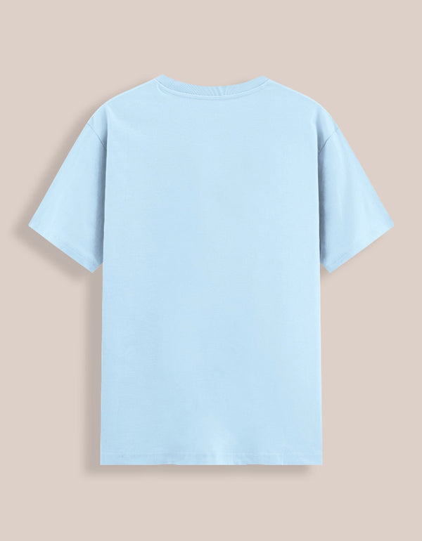 Light blue t-shirt on a beige background