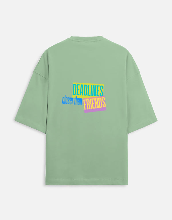 Green t-shirt with colorful text on the back against a white background
