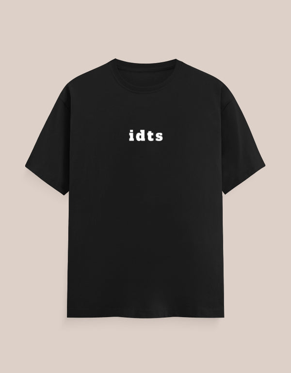 Black t-shirt with 'idts' text on a beige background