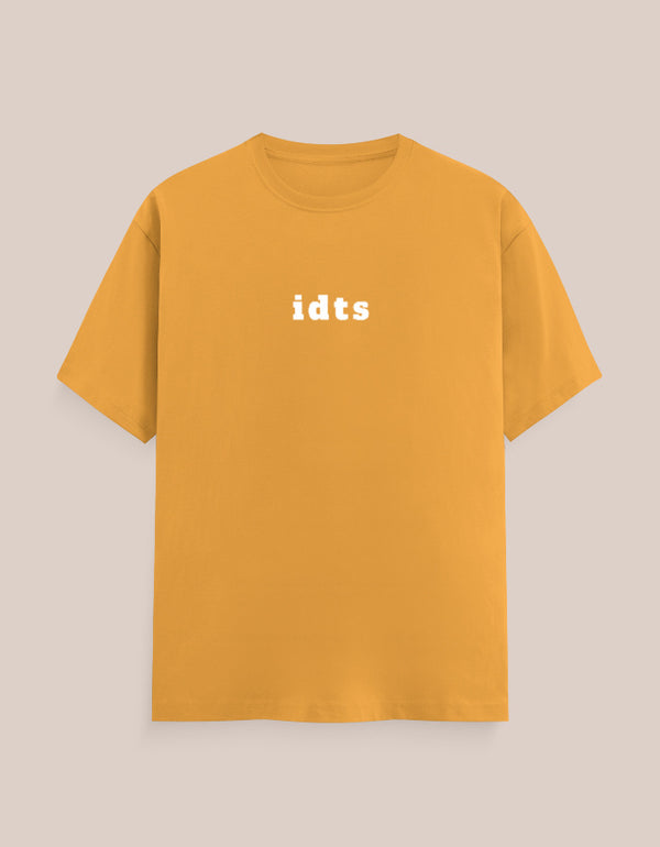 Yellow t-shirt with 'idts' text on a beige background