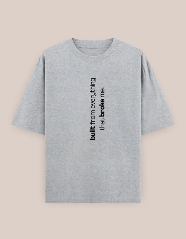 Gray t-shirt with black text on a beige background