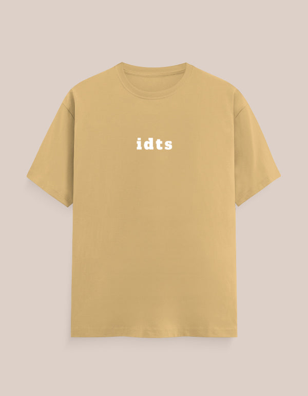 Yellow t-shirt with 'idts' text on a beige background