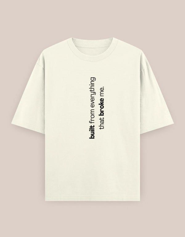 White t-shirt with black text on a light pink background