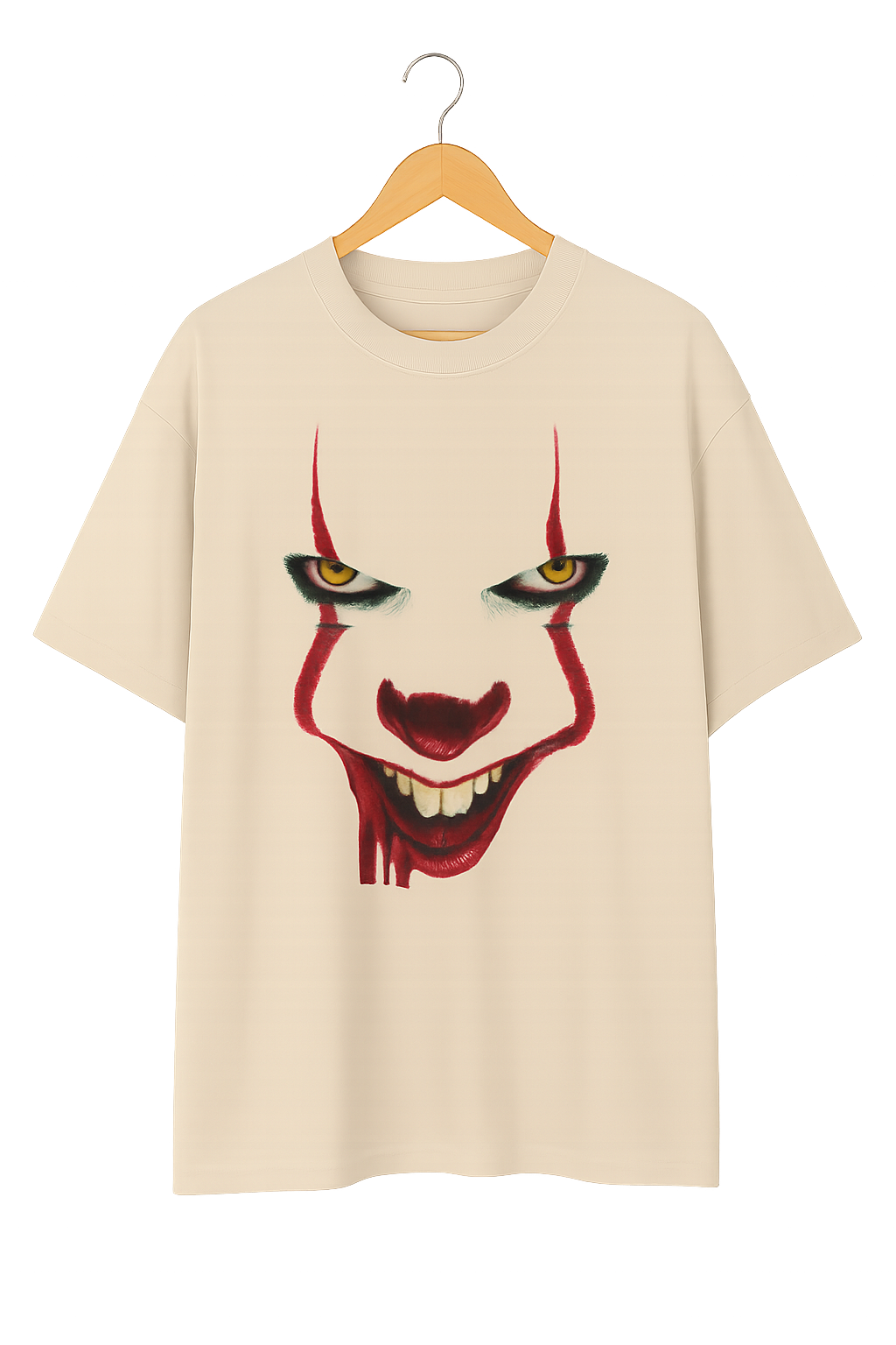 Beige t-shirt with a clown graphic on a hanger against a white background